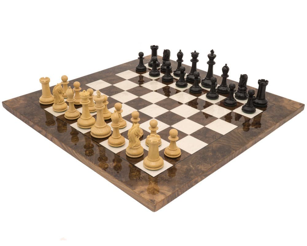 The Monarch Ebony And Walnut Grand Luxury Chess Set on a polished board with pieces arranged for a game.