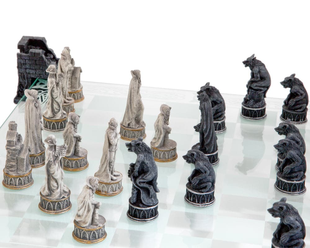 Detailed Vampire and Werewolf characters on a raised glass chess board with ruined castle resin pillars by Nemesis Now.