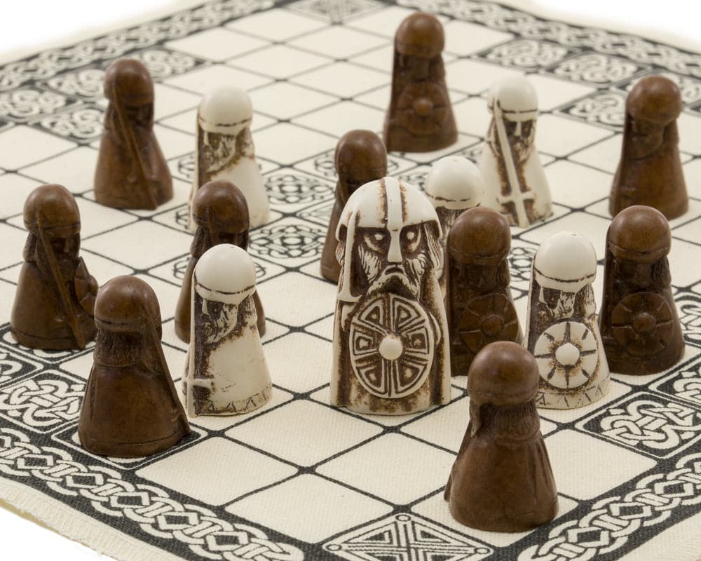 Viking Hnefatafl board game with detailed playing pieces on a linen surface by National Museum of Scotland