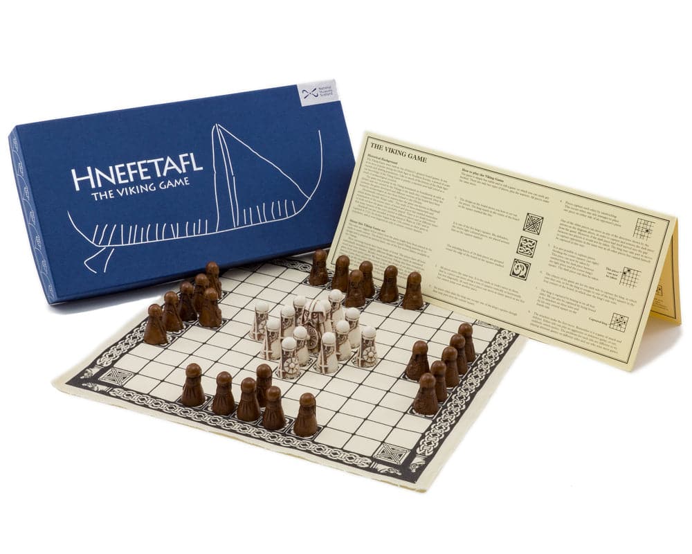 Viking board game Hnefatafl with pieces, linen surface, and rules leaflet from the National Museum of Scotland in gift box