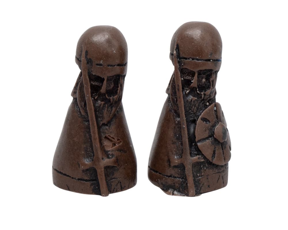 Medieval warrior chess pieces with swords and shields in dark brown finish.