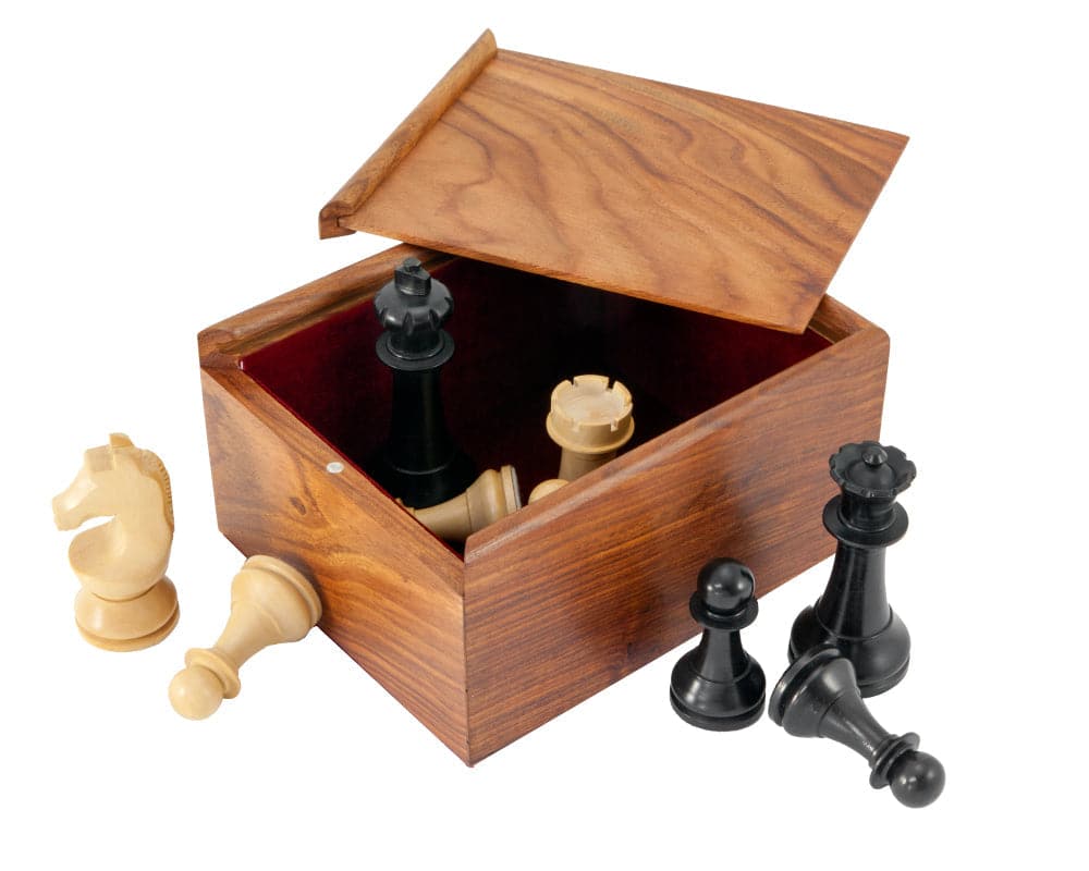 Solid wood chess piece case with sliding lid, holding various black and white chess pieces, made from luxurious exotic hardwood.