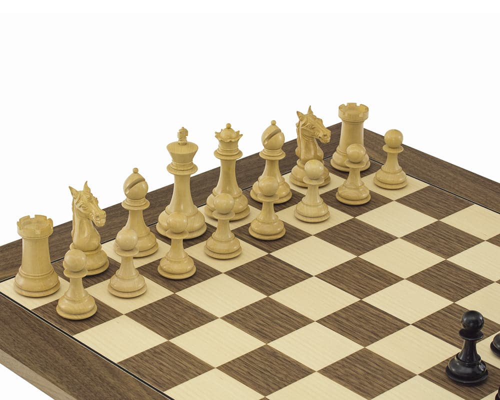 Columbus Series Chessmen in ebony on a chessboard, featuring a 4-inch king and ornate Staunton design, ideal for a 21.7-inch board.