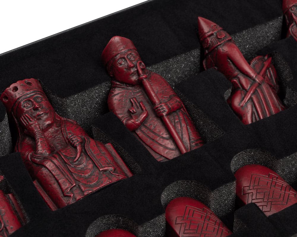 Red Isle of Lewis handmade chessmen set in sculpted resin with intricate details on chess pieces, official limited edition.