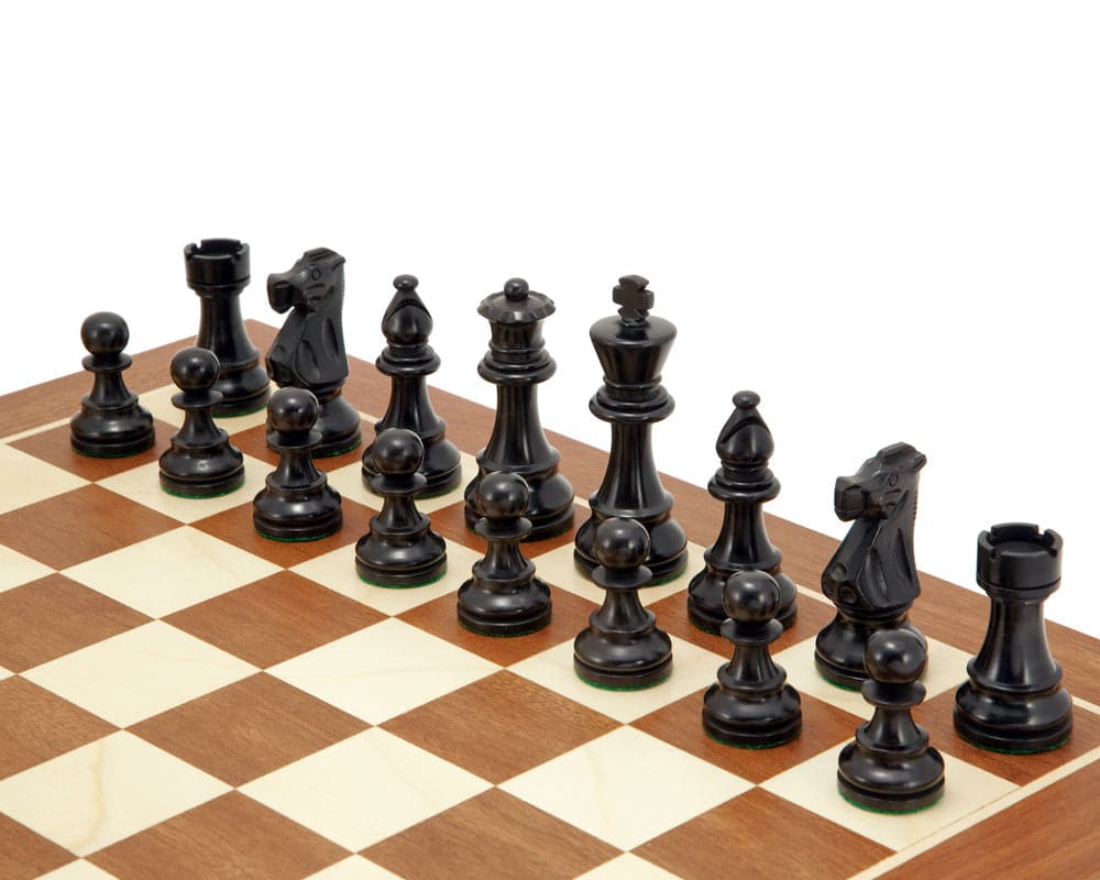 French Knight black mahogany chess set displayed on a 19-inch mahogany and maple chessboard with expertly handcrafted chessmen.