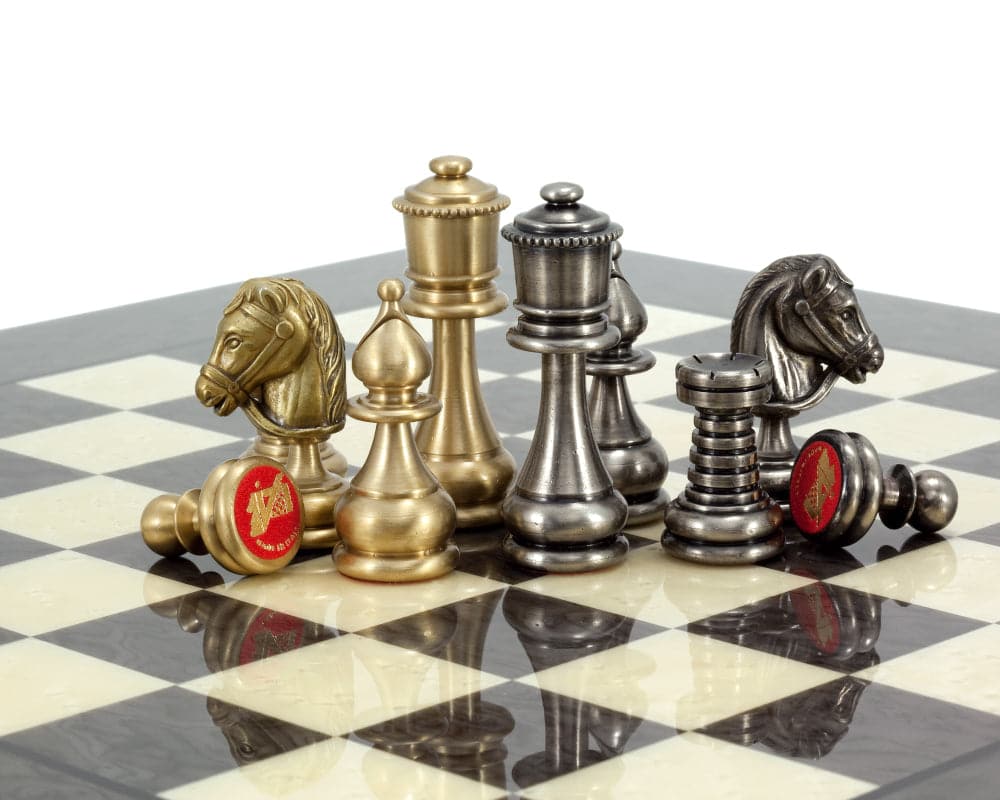 Verona Chess Set with Brass and Nickel plated pieces on a chessboard, showcasing detailed and lacquer-coated Italian craftsmanship.