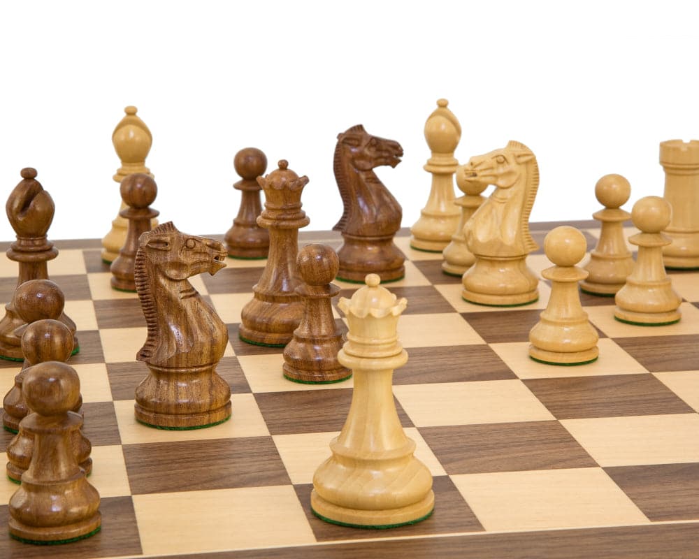 Winchester Sheesham Tournament Chess Set with hand-carved knights and traditional Staunton design on a chessboard.