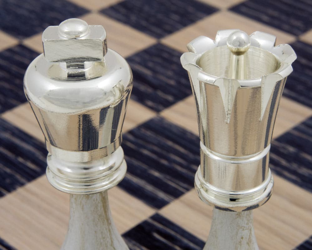 Detailed view of The San Severeo Chess Set silver king and rook pieces on a chessboard