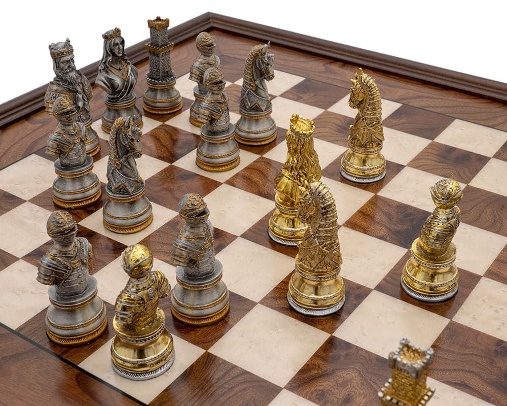 Medieval Pewter and Briarwood Luxury Chess Cabinet Set with intricate gold and silver chess pieces on a wooden chessboard.