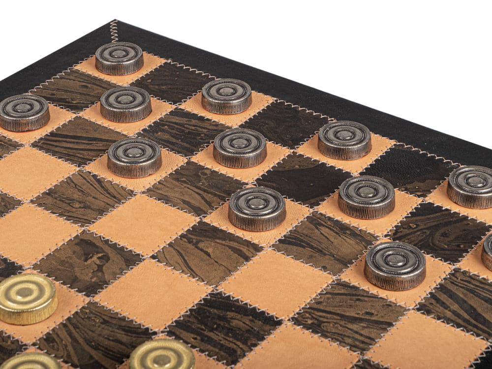 The Italfama leather and metal luxury draughts set board close-up, showcasing high-quality craftsmanship with metal pieces on a leather surface.