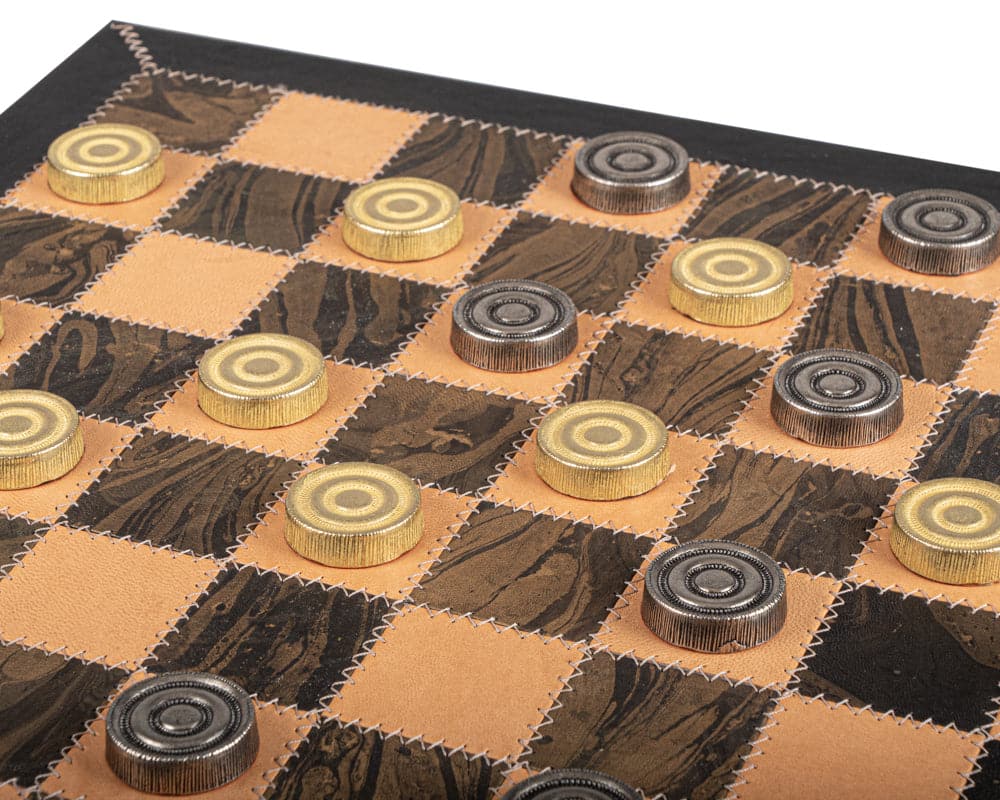 Italfama luxury draughts set with leather and metal pieces on a wooden cabinet board