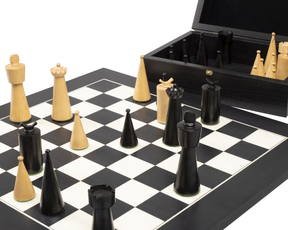 Art Deco black chess set with modern design pieces on a black and white board.