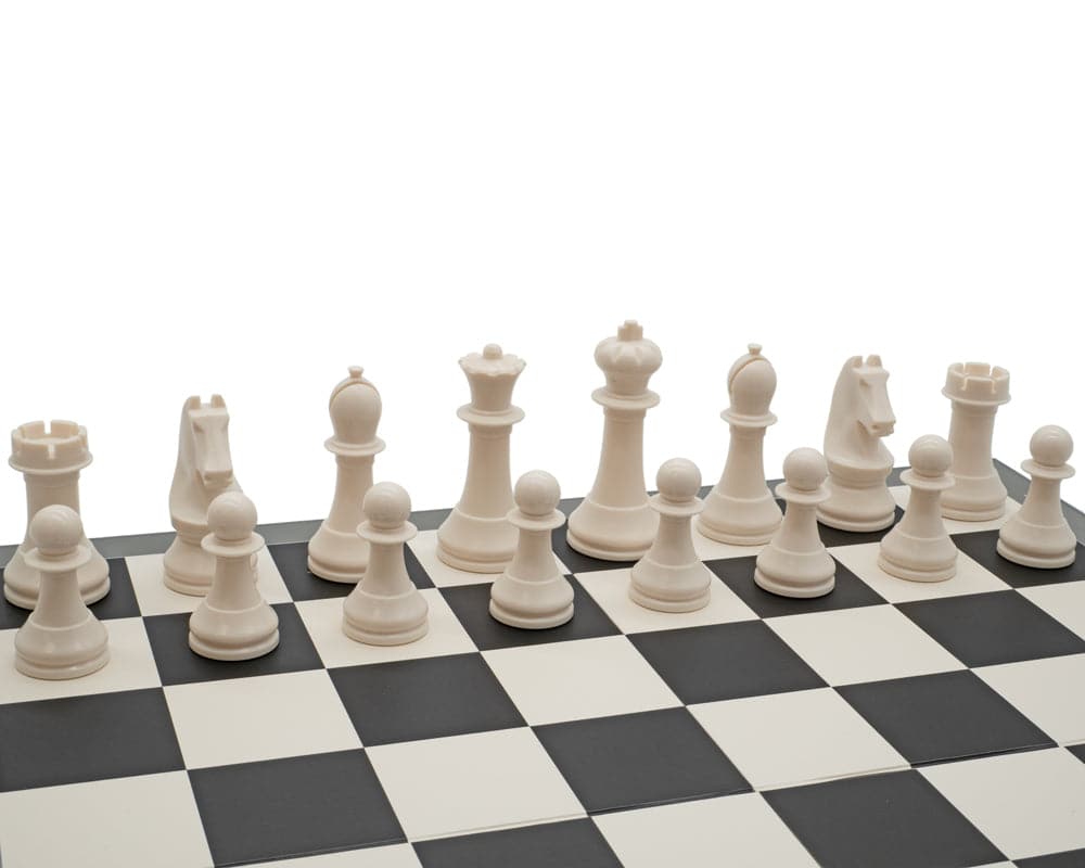 Weighted white chess pieces on foldable black and white chess board from the World Chess Championship Set - Academy Edition